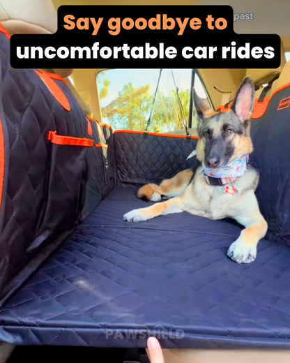 Dog sitting on a car seat cover with text 'Say goodbye to uncomfortable car rides' and 'PAWSHIELD' branding.